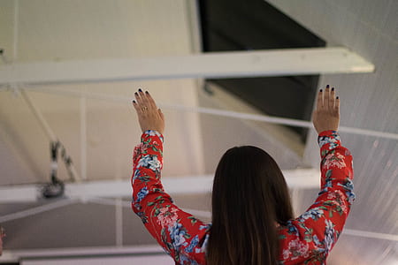 woman raising her hands up in air thumbnail