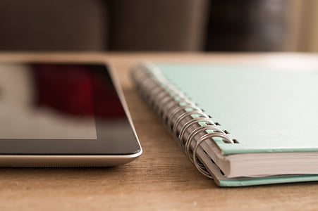 shallow focus photography of teal spiral notebook thumbnail