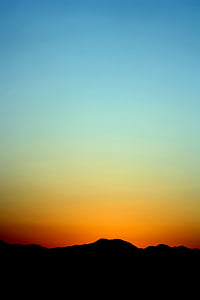 silhouette photo of rock formation during golden hour thumbnail