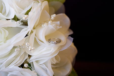 silver-colored ring on white bouquet thumbnail