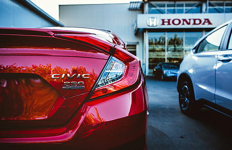 red Honda Civic taillight in close-up photo at daytime thumbnail