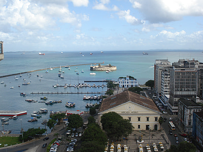 brown and white buildings and boats at daytime thumbnail