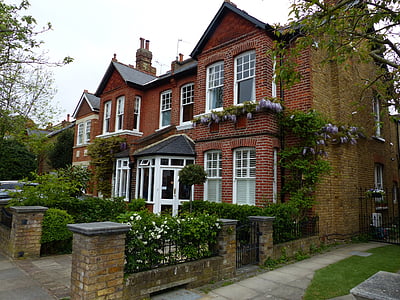 red and white concrete house during daytime thumbnail