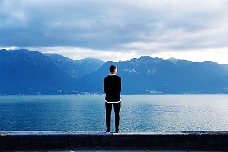 photography of man wearing black shirt and pants thumbnail