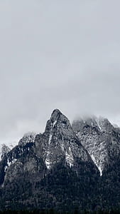 landscape photography of snowy mountain covered with fog thumbnail