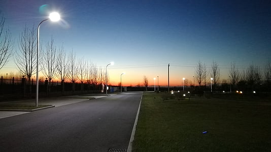 view of a street in dusk thumbnail