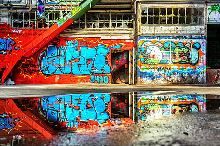 concrete wall with assorted color wall art thumbnail
