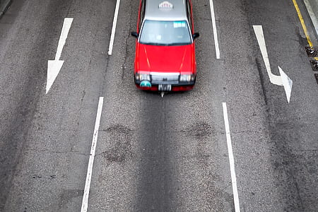 red and gray car on gray road during daytime thumbnail