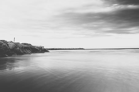 grayscale photography of calm body of water thumbnail