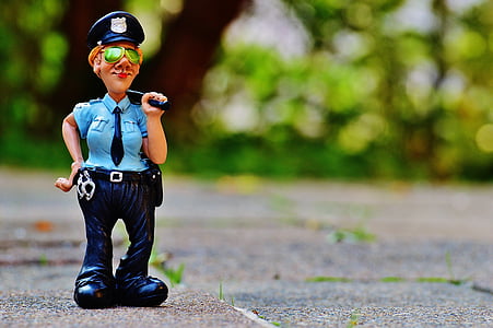 selective focus photography of police woman action figure thumbnail