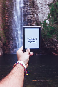 Person Holding Kindle thumbnail