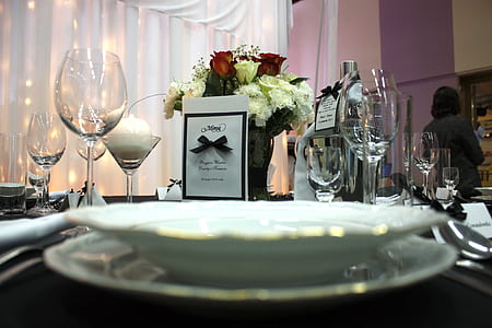 round white plate beside wine glasses thumbnail