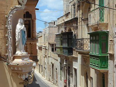 religious statue on building at daytime thumbnail