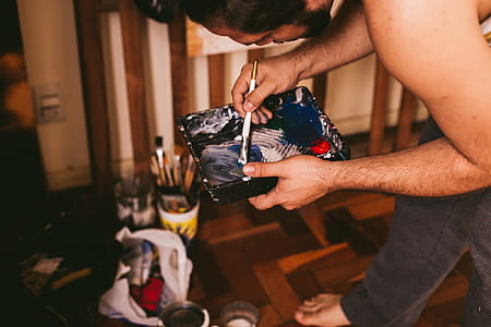 Man Holding Paint Brush thumbnail