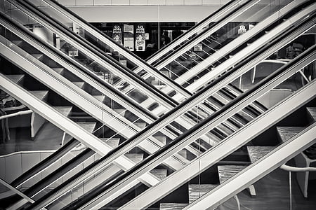 gray scale photo of escalators thumbnail