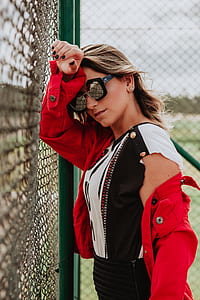 woman leaning on fence thumbnail