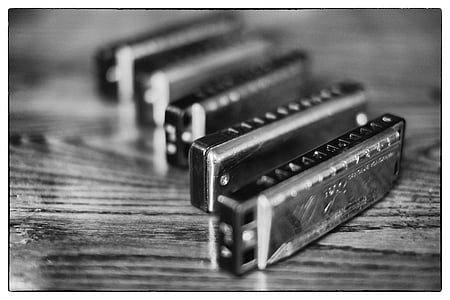 grayscale photography of harmonica thumbnail