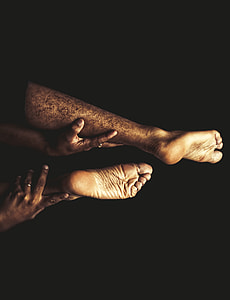 person holding leg photo thumbnail