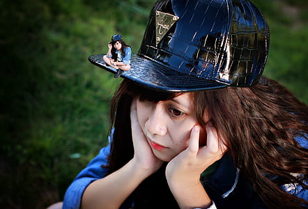 woman wearing black fitted cap on green grass thumbnail