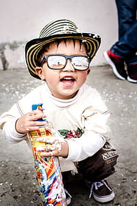 Photography of Kid Wearing Sunglasses thumbnail