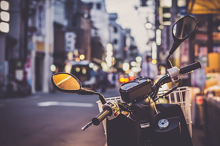 shallow focus photography of black and white motorcycle thumbnail