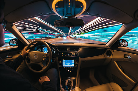 timelapse photography of person driving Mercedes-Benz vehicle thumbnail