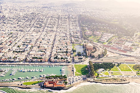 aerial photography of city near body of water at daytime thumbnail