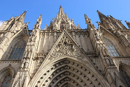 low angle photography of beige concrete cathedral thumbnail
