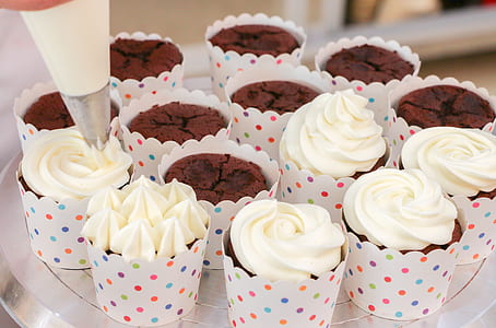 person putting icings on cupcakes thumbnail