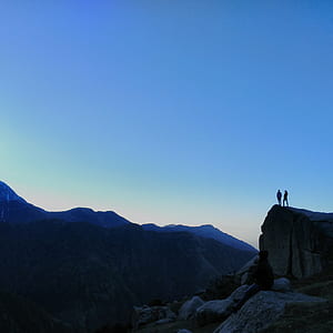 two person standing on mountain cliff thumbnail
