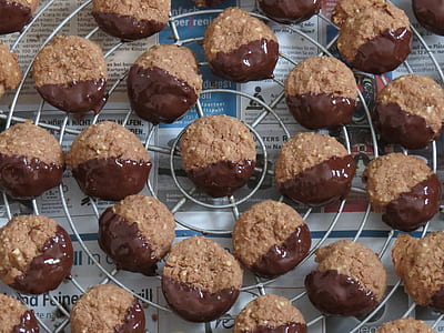 chocolate dipped pastries on silver rack thumbnail