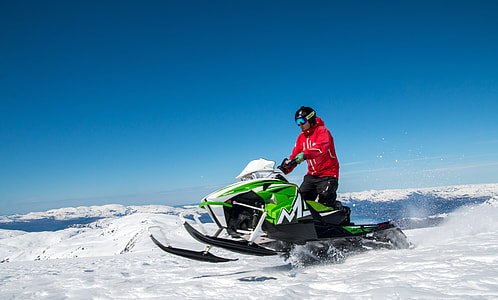 man riding snowmobile thumbnail