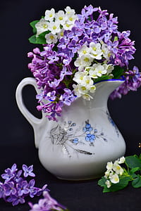 white and purple flowers in white ceramic pitcher thumbnail