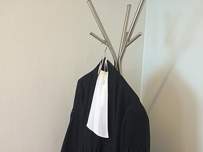 black top hanging on gray stainless steel rack thumbnail
