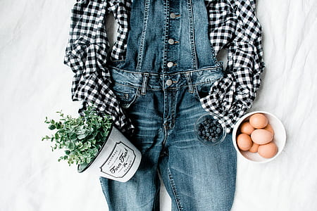 brown eggs in white bowl beside blue denim bottoms thumbnail
