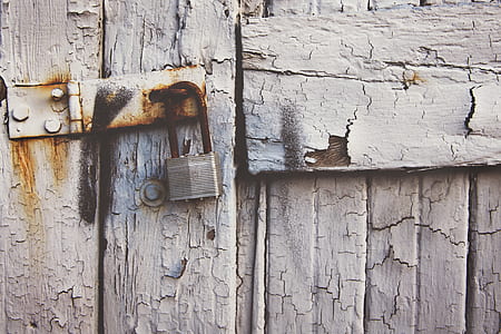 rustic padlock hanged on the door thumbnail