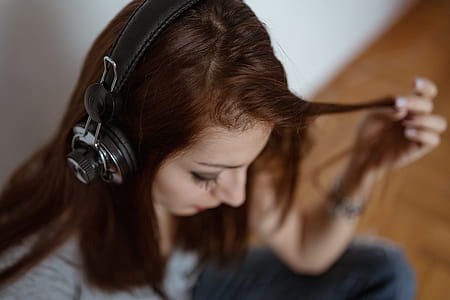 Beautiful young woman in headphones listening to music thumbnail