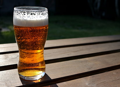 pilsner glass with brown liquid inside thumbnail