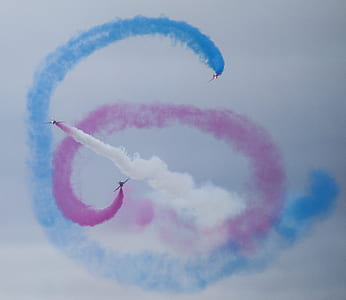 several jet planes with colored jet streams thumbnail