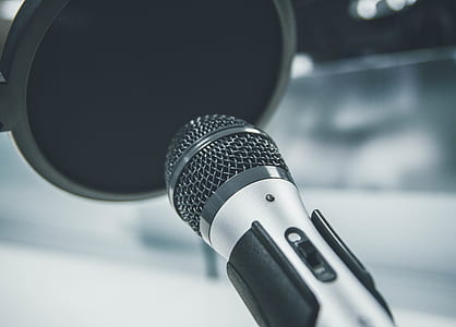 shallow focus of gray dynamic microphone and pop filter thumbnail