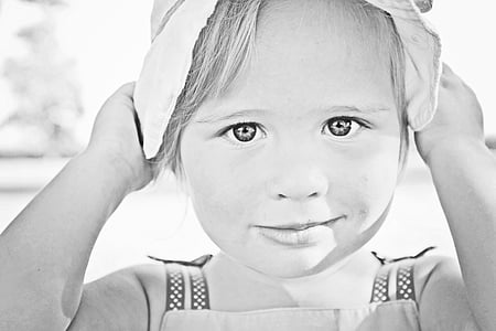 girl smiling wearing hat thumbnail