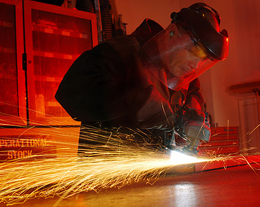 person wearing black jacket while holding power tool thumbnail
