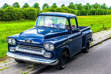 classic blue Chevrolet single cab truck on road near grass during daytime thumbnail