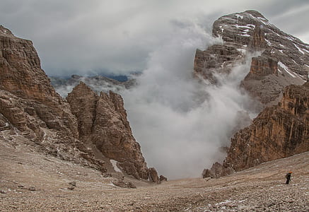 brown mountain rock under cloudy sky during daytime thumbnail