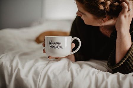 person holding white ceramic cup thumbnail