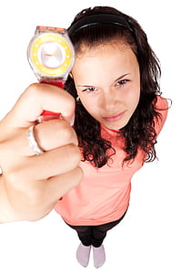 woman in pink top holding round silver-colored analog watch with red strap thumbnail