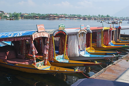 seven yellow boat on water at daytime thumbnail