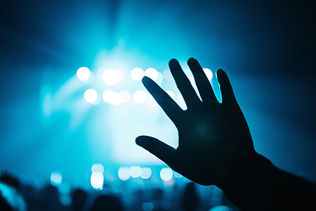 Man raising his hand a music concert party thumbnail