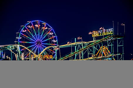 turned-on lights of Ferris wheel at nighttime thumbnail