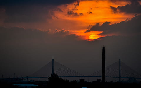 silhouette of bridge during golden hour thumbnail